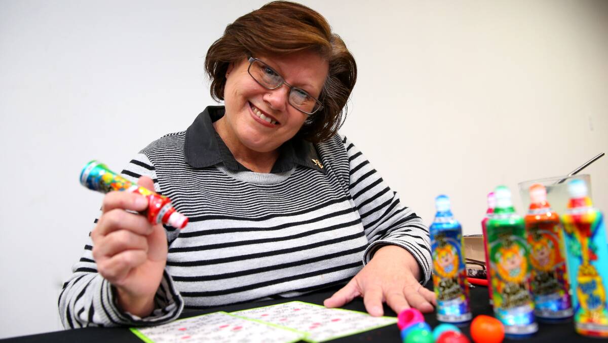 Dabbing her way to happiness: Hobartvilles Cindy OLoughlin says the best hing about playing bingo is the people you meet. Picture: Geoff Jones