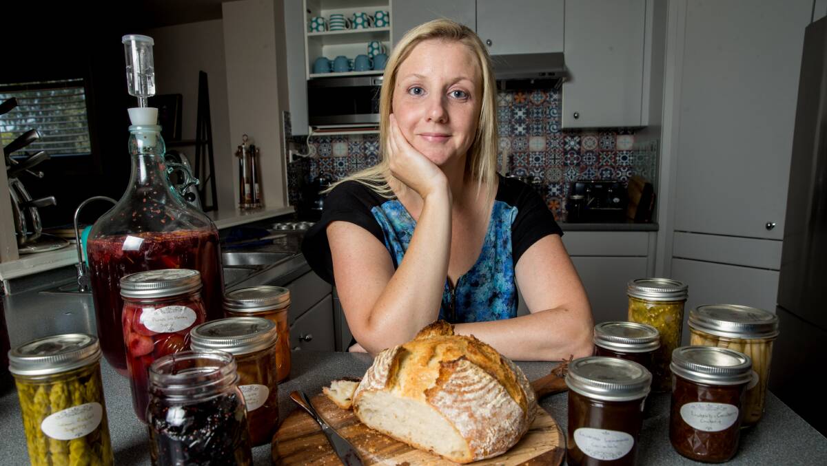 Kirsty Berte with her canned goods and sourdough bread she made from scratch. Picture: Geoff Jones