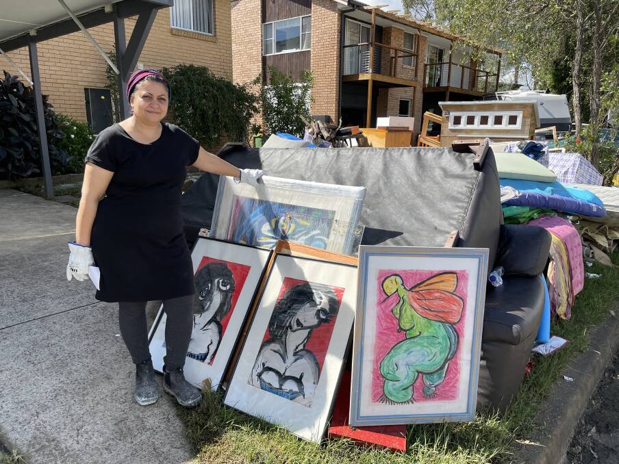 Nazanin Marashian with artworks she had prepared for an upcoming exhibition in Fairfield. They are too water-damaged to keep. Picture: Sarah Falson