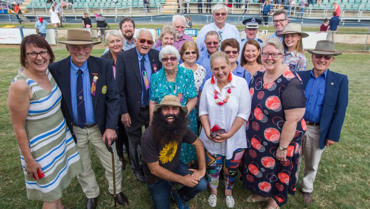 DIGNITARIES: HDAA president Ross Matheson (back row, blue shirt) with officials and celebrity gardener Costa Georgiadis (front, crouching) before the Grand Parade on Day Two of Hawkesbury Show 2018. Picture: Geoff Jones