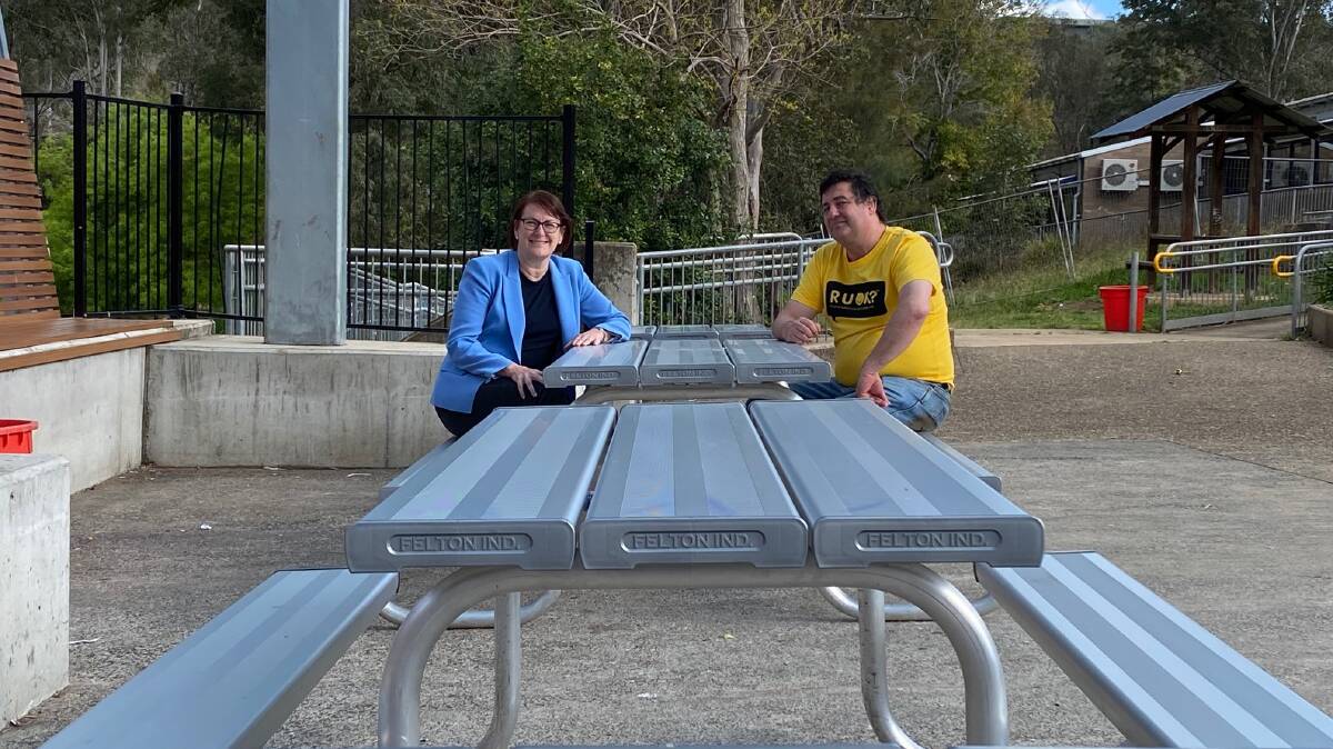 Have a seat: Federal Member for Macquarie Susan Templeman and Colo High School Principal Mark Sergeant sitting on some of the new seats in the schools quadrangle. Picture: Supplied