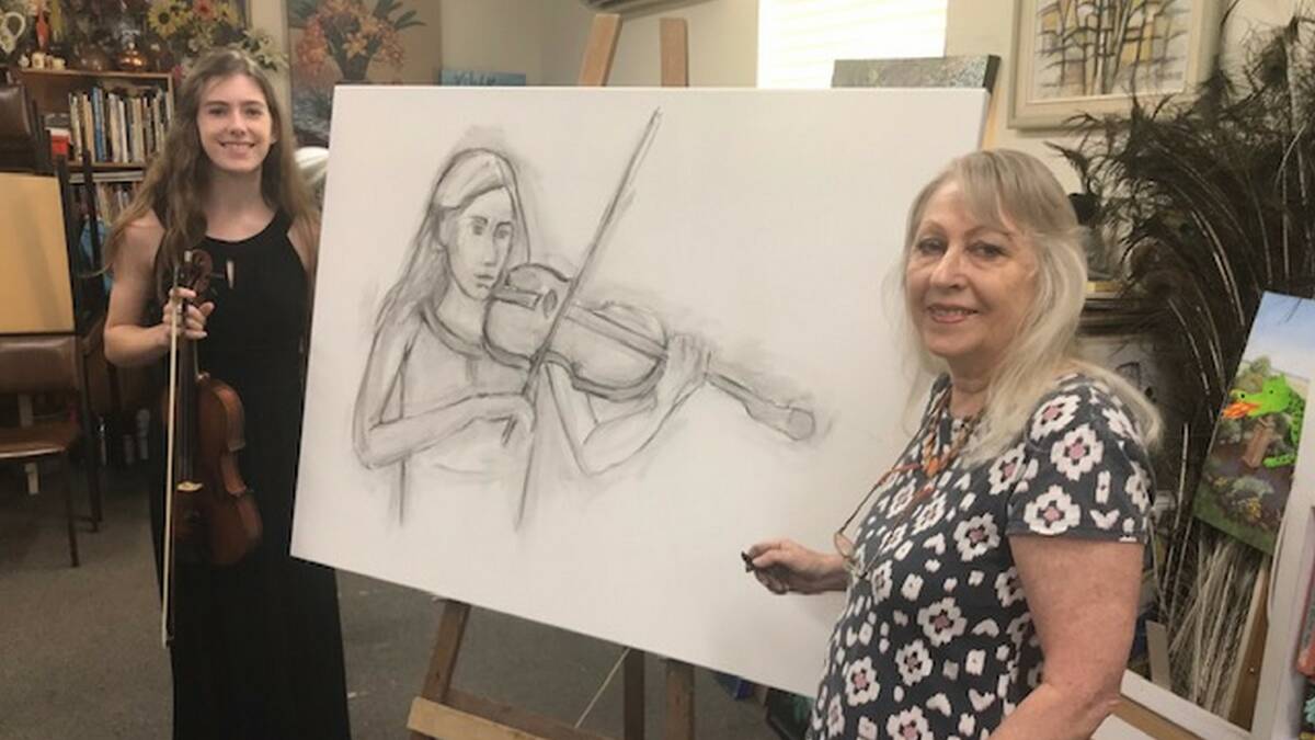 The first sketch: Richmond Art Supplies co-owner Deidre Morrison begins to sketch a likeness of Arabella Logan for her Archibald Prize entry. Picture: Graeme Logan