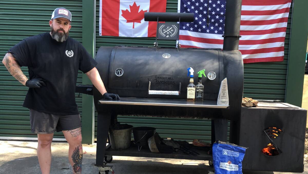 READY, SET, COOK!: Russell Crosdale with his Radar Hill Reverse Flow Offset Smoker (which weighs 900 kilograms) at his Glossodia home. Picture: Supplied