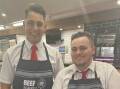 Munro's Quality Meats butcher's apprentice Jayden Hermon (L) and butcher Ty Longford are staying with their boss, Craig Munro, through the floods. Picture: Supplied