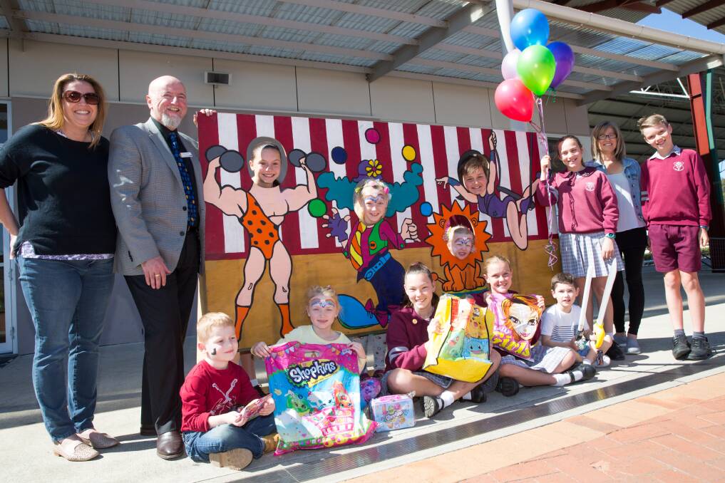 GET READY: Principal Michael Mifsud with students and P&C parents getting pumped for the upcoming Twilight Fair at Chisholm Primary School. Picture: Geoff Jones
