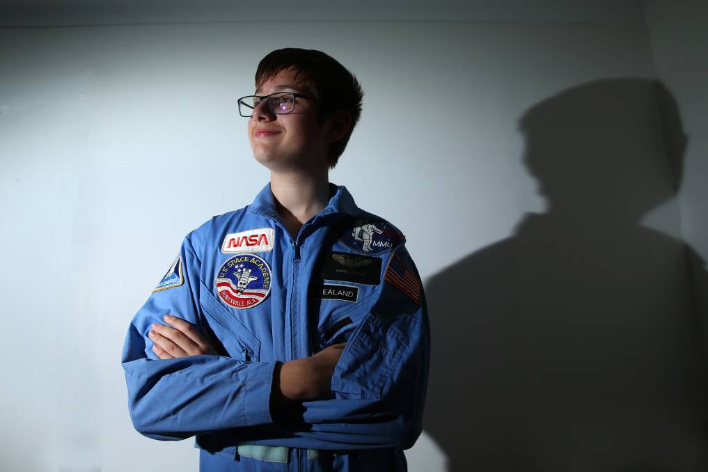 Richmond High student Lachlan Kalie wearing the jacket his dad got when he attended Space Camp as a lad. Pictures: Geoff Jones