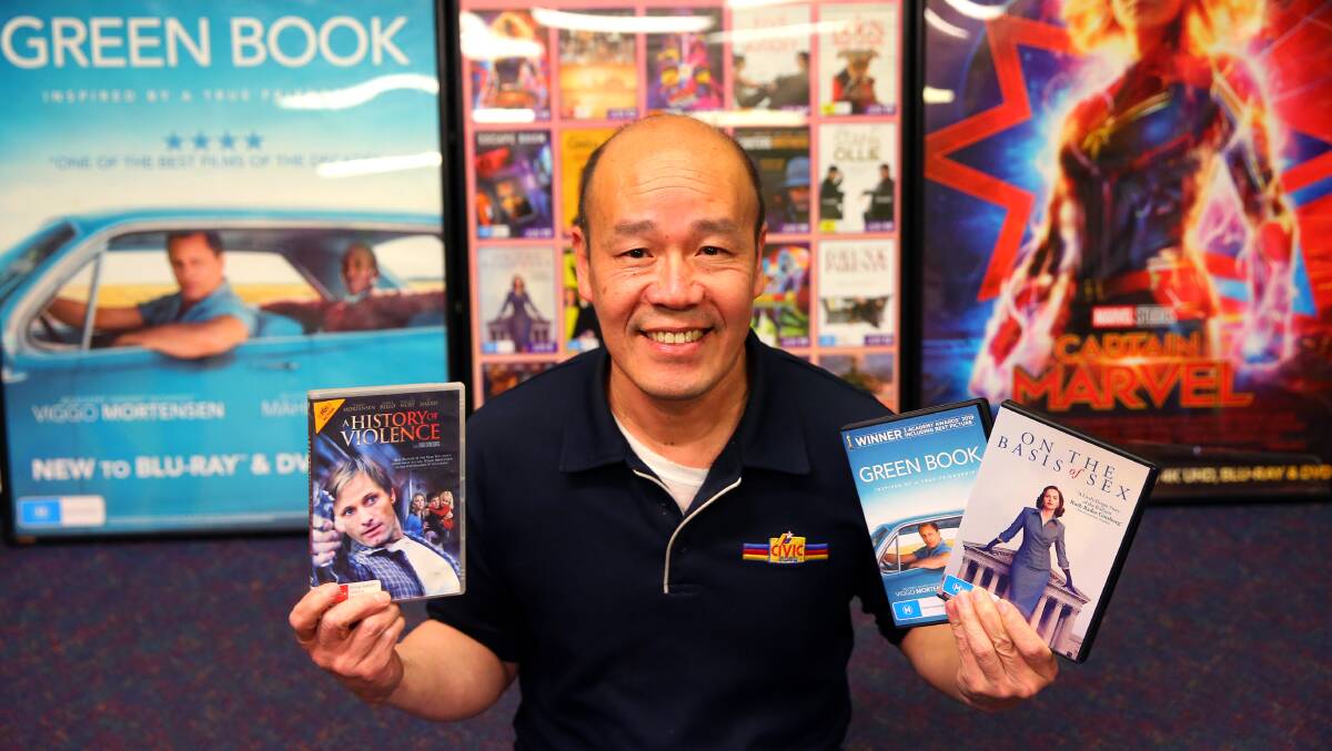 Top recommendations: Civic Video Windsor owner Guirong Wu aka The Last Kangaroo with some of his favourite films for the month, including Green Book which won the 2019 Oscar for Best Picture. Picture: Geoff Jones