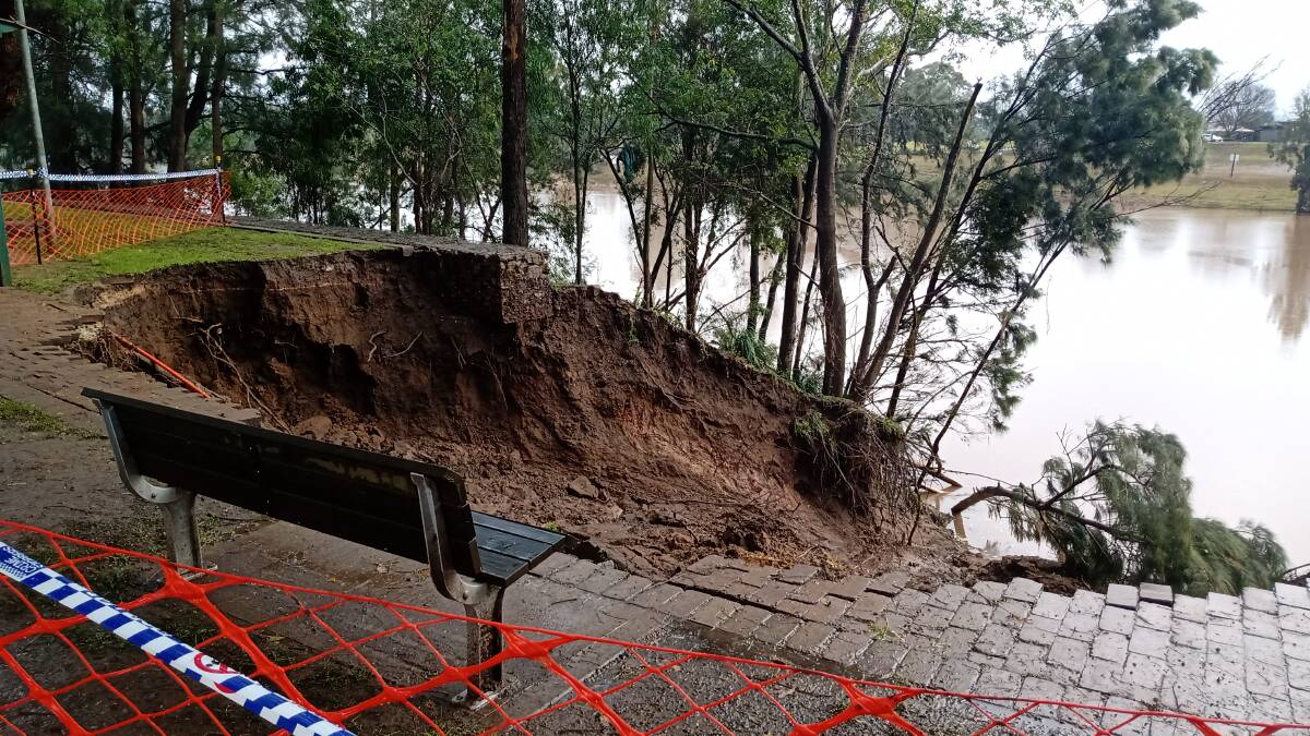 A landslide along the riverbank, taking with it part of the footpath along The Terrace at Windsor, shows how high and strong the flood currents were. Picture: Sarah Falson 