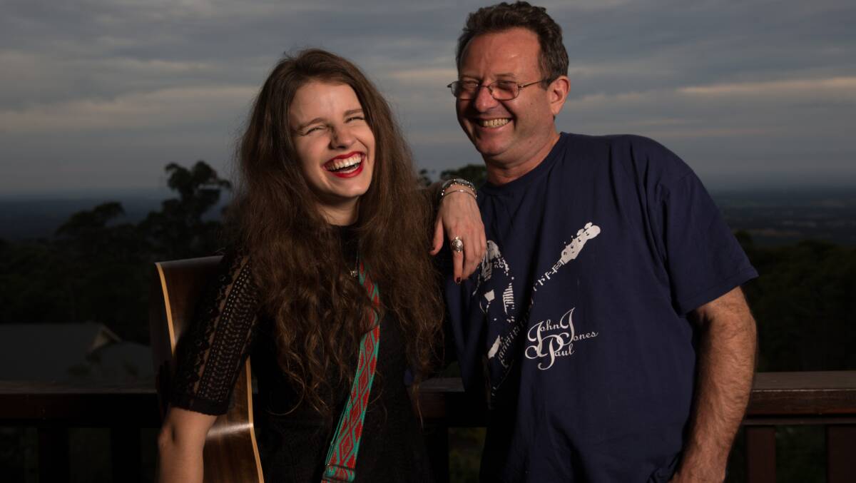 HEART AND HOME: Imogen and her dad Mark, a teacher and musician himself, at their Bowen Mountain home in 2016. Picture: Geoff Jones