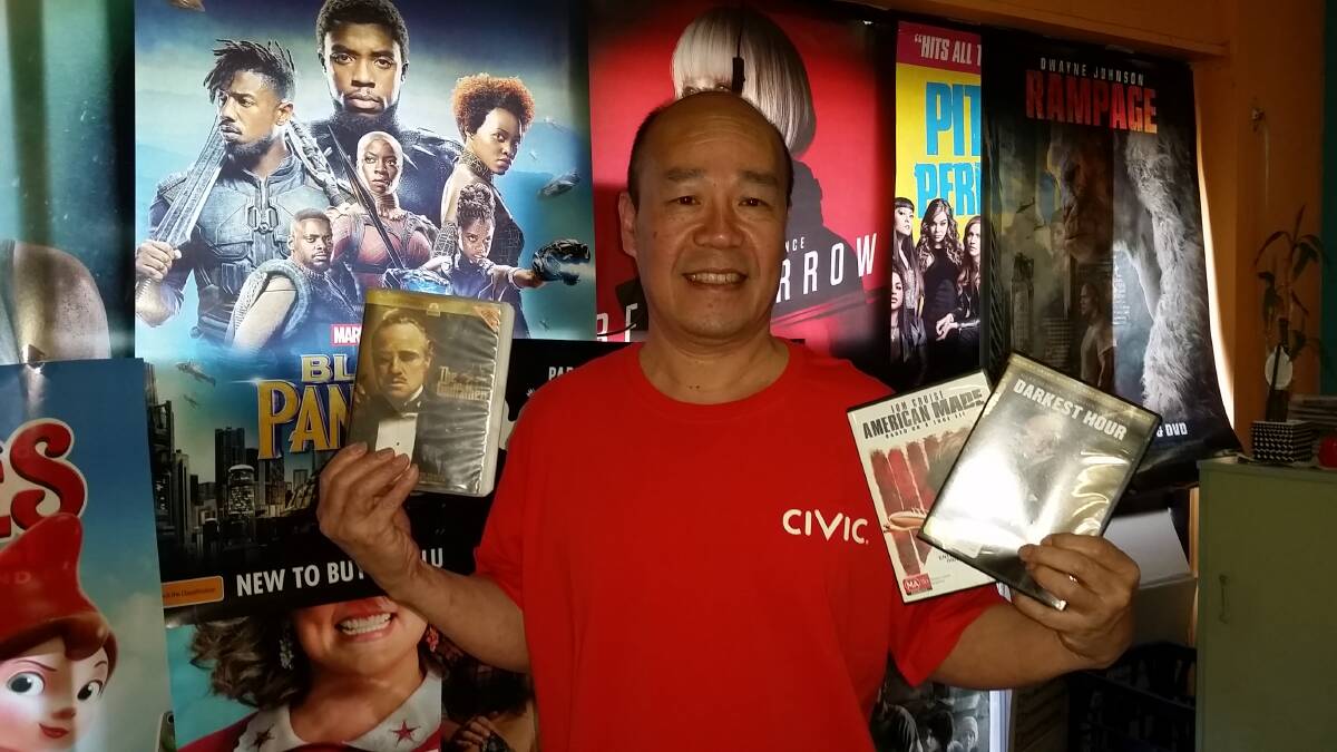 Guirong Wu with his top movie recommendations for this month, at his Civic Video store in Windsor. Picture: Sarah Falson
