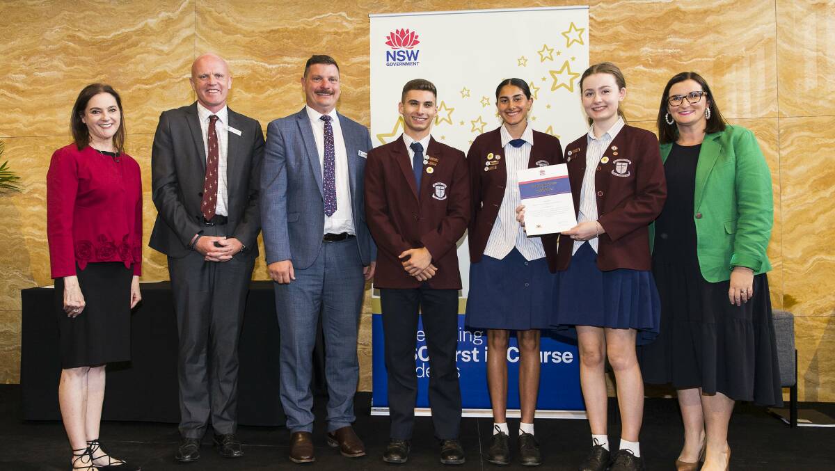 Bede Polding College representatives accept a Ministerial Commendation for flood resilience from Minister for Education Sarah Mitchell. Picture supplied