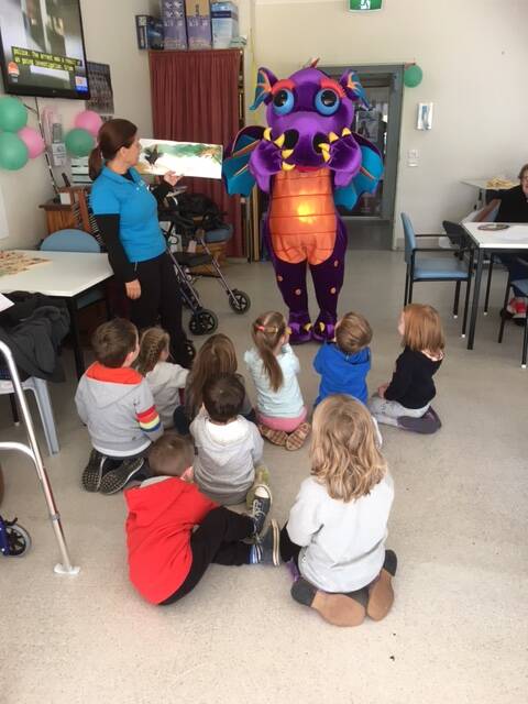 SPECIAL GUEST: Puddles the dragon visited the nursing home with the kids from Bilpin preschool in June. Picture: Melinda Davis