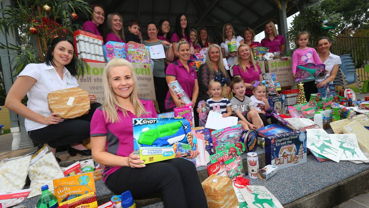 Helping hand: Oakville Preschool educators and students with parents, and Pitt Town and surrounding suburbs community members with Christmas donations they collected for the community of Trundle. Picture: Geoff Jones