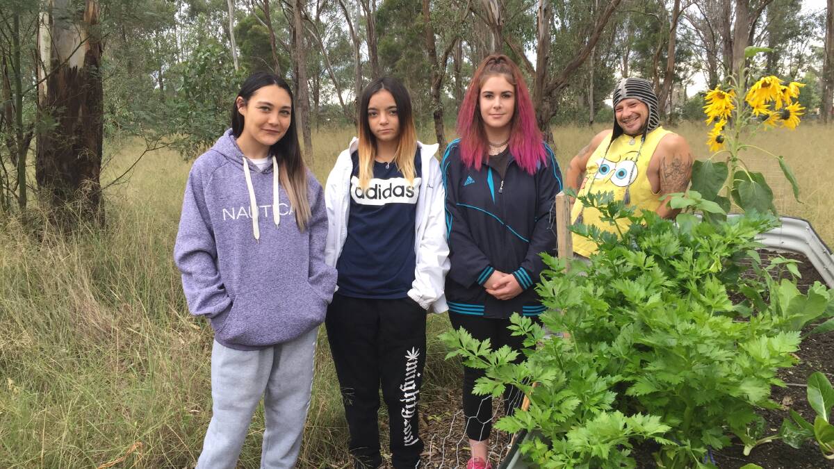 PRACTICAL LEARNING: Students Lilli (16, Bligh Park), Kim (16, Windsor) and Skyelee (15, East Richmond), with Stuart the gardener, pictured beside the vegetable garden they've been tending at the school.