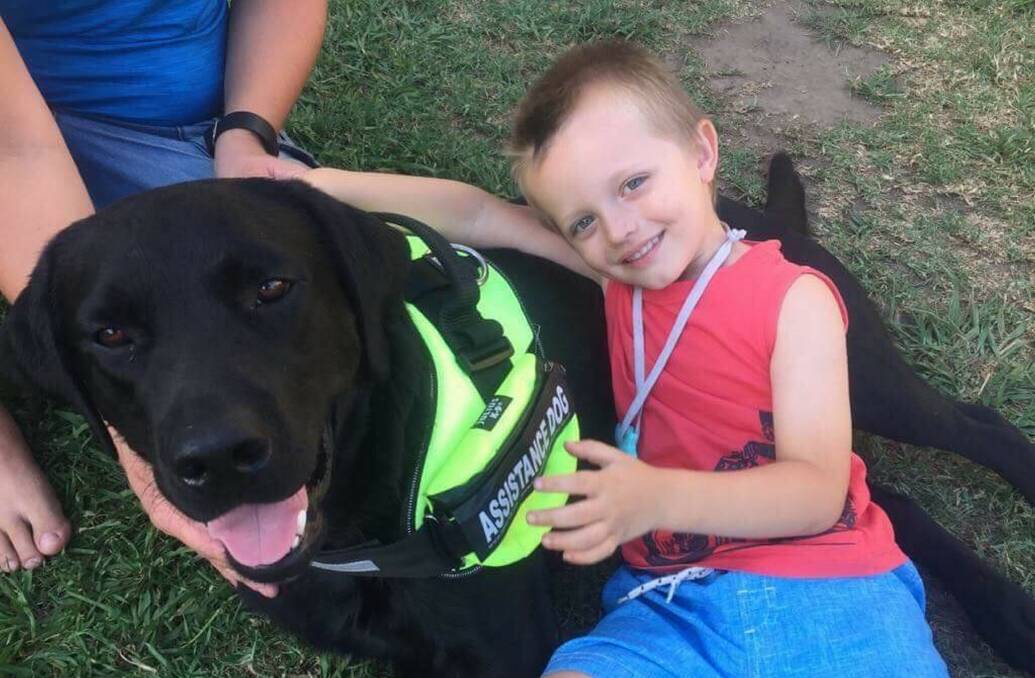 BEST MATES: Four-year-old Dominic and his assistance dog Buddy. Pictures: Supplied