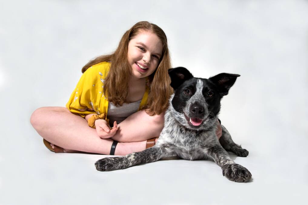 Family love: Bligh Park's Emma Hynes with the Hynes family dog, Mayzie, who is a cattle-dog-cross-border-collie. Picture: Geoff Jones