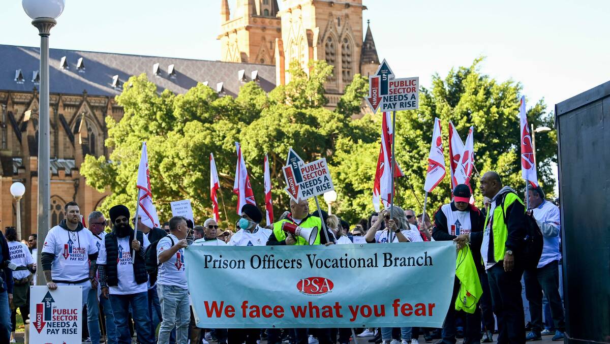 Thousands of striking public service workers have marched outside the NSW parliament. Photo: Bianca De Marchi/AAP PHOTOS