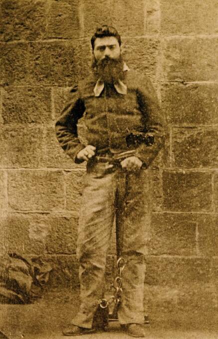 Doomed: Ned Kelly photographed against the wall of the prison where he would die the following day.
