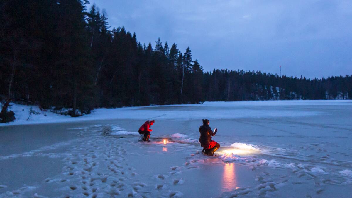 We head out onto the frozen lake to try our hand at ice fishing.