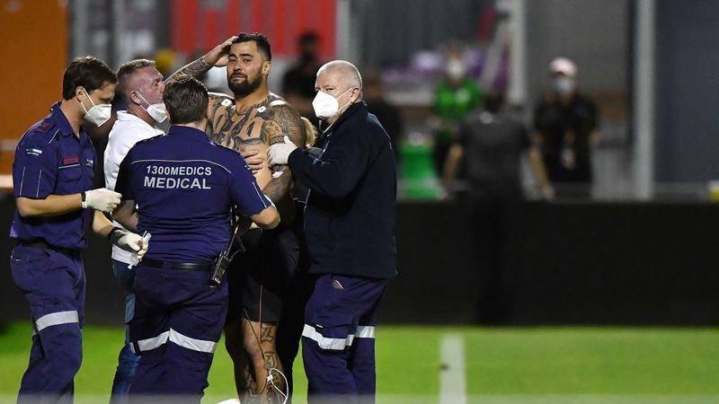 Life-threatening condition: A distressed-looking Andrew Fifita receives treatment after the game before being rushed to hospital.