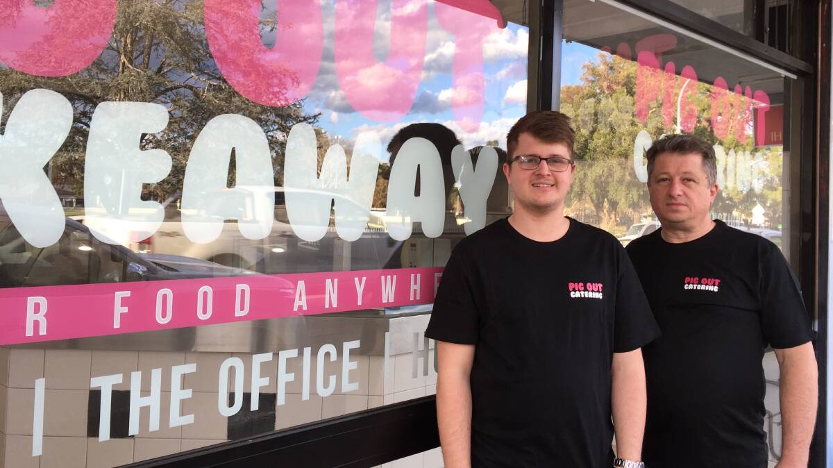 Josh Domars and his father Mark at the front of their new Pig Out Takeaway in Windsor Street, Richmond. Picture: Sarah Falson