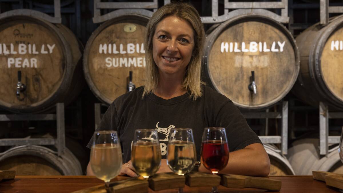 Emma Watson from Hillbilly Cider with a tasting paddle. Picture: Simon Bennett