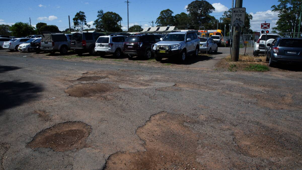 State of disrepair: Residents are calling on the government to treat Mulgrave railway station car park to an urgent facelift. Picture: Geoff Jones