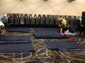 Helping hands: Volunteers inflate mattresses at Richmond Club for those having to evacuate their homes due to the floods. Picture: Susan Templeman MP Facebook page