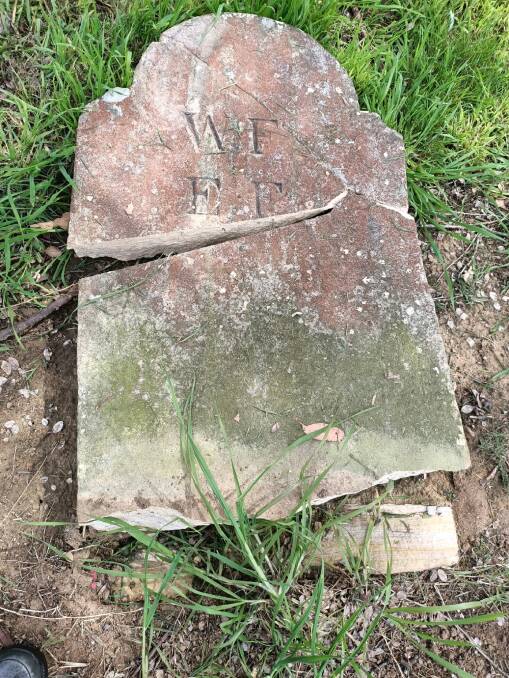 Broken: The vandalised marker at St Matthew's Anglican Cemetery in Windsor. Picture: Supplied