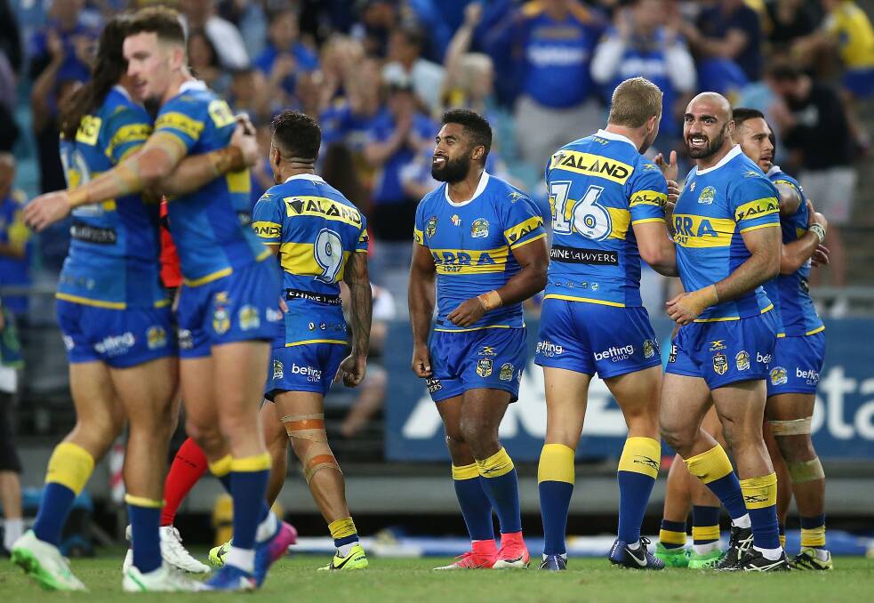 Happy days: Parramatta Eels players celebrate their round seven victory over the Wests Tigers. Picture: Getty Images