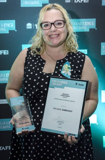 Melanie Gabbusch with her TAFE Digital 2018 Tourism and Experience Services Student of the Year Award.