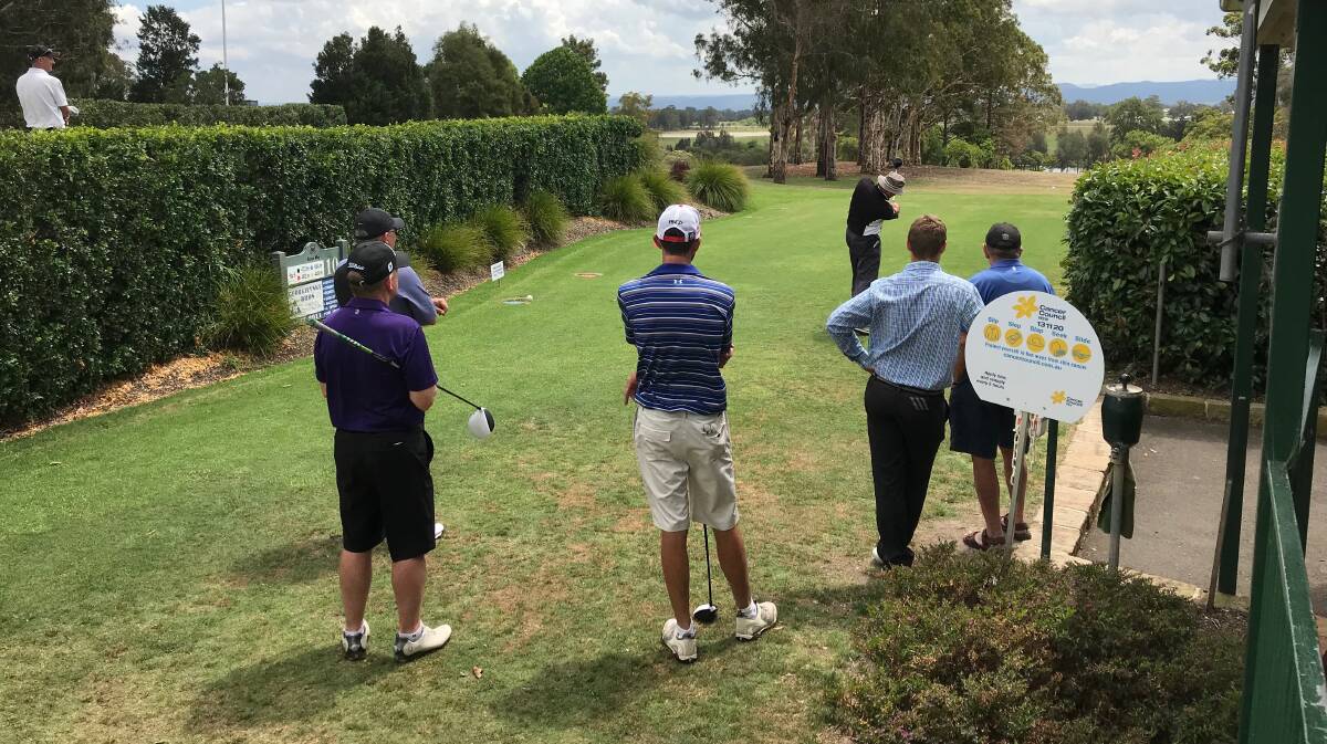 Competitors tee off during last year's event.