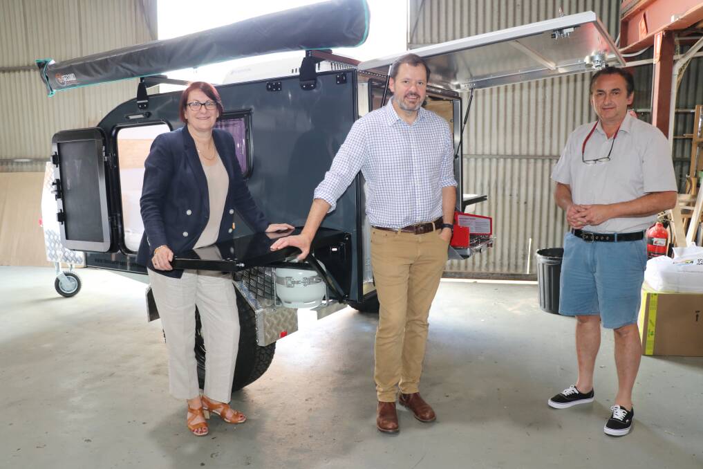 Macquarie MP Susan Templeman with Shadow Minister for Industry and Innovation Ed Husic and Frank Scenna at the Teardrop Camper Company warehouse in South Windsor.
