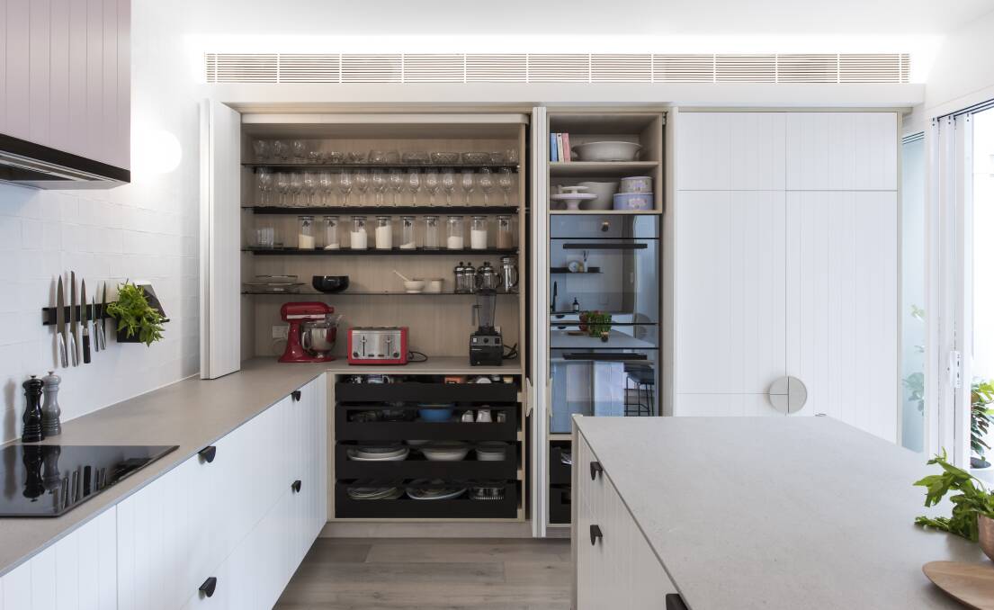 Kitchen design of the year: The cabinetry integrated into the side of, and above, the bench ensures everything is within reach during food preparation and quick to store away for a clean, minimalist look. Photos: HIA/Minosa Pty Ltd 
