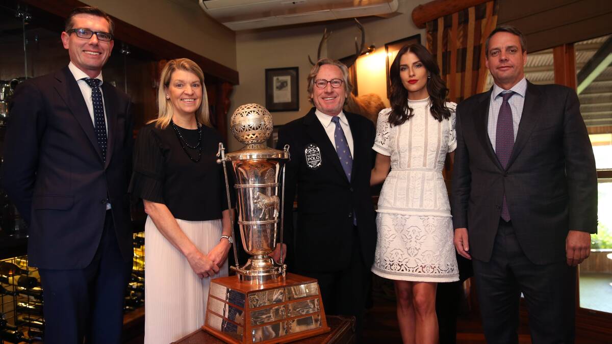 Dominic Perrottet, Kitty Chiller, Peter Higgins, Erin Holland and Tim Clarke with the Federation of International Polo's world cup trophy. Picture: Geoff Jones
