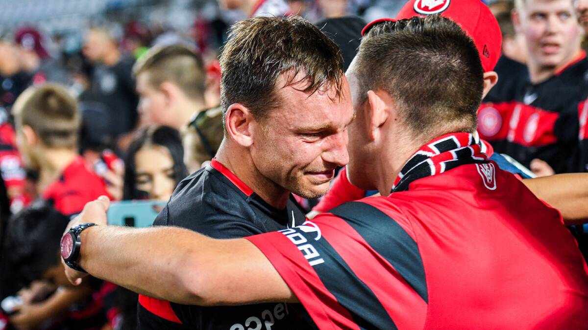 Brendon Santalab embraces a fan after a tough loss in the 2017-18 A-League saeason. Santalab was a favourite with the fans. AAP Image/Brendan Esposito