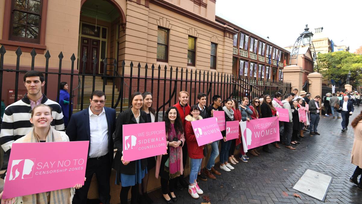 People gather outside Parliament on Thursday, June 7 ahead of the debate on the 'safe access zone' abortion laws debate. Picture: AAP Image/Peter Rae