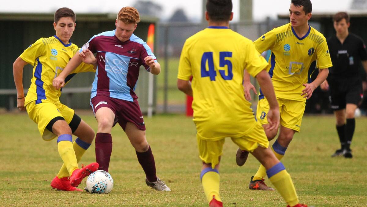 Kynan Lane plays for Hawkesbury City's under-18s team in their 4-2 victory over Dulwich Hill on Saturday. Picture: Geoff Jones 