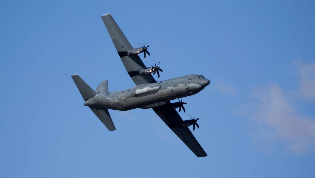 A C-130J Hercules transport aircraft flies over the Hawkesbury region. Picture: Geoff Jones