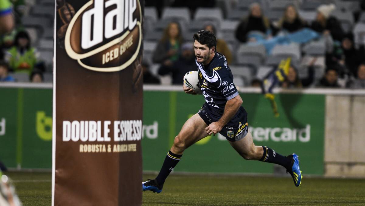 Lachlan Coote scores a first-half try against the Canberra Raiders on Saturday night. Photo: Dion Georgopoulos, Fairfax Media