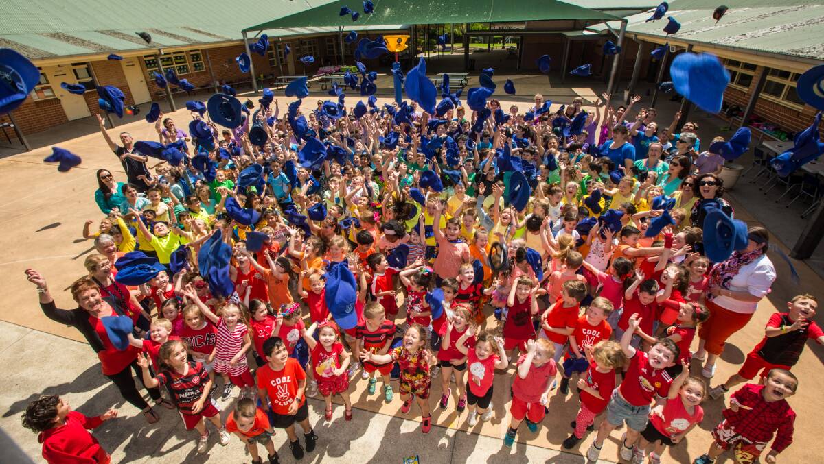 COLOUR FOR CHARITY: Pupils and teachers at St Monica's Primary School Richmond raise money for Mary MacKillop Today with a rainbow day. Picture: Geoff Jones