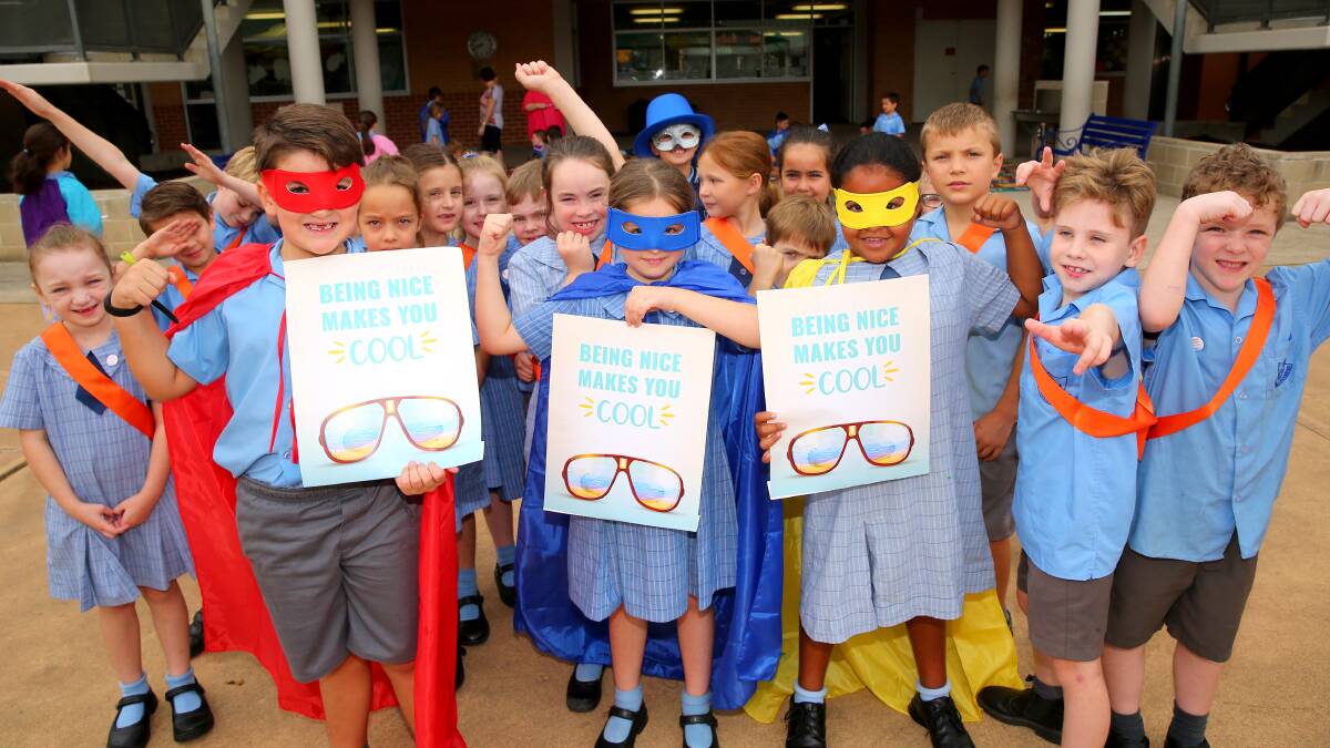 Caped crusaders spread anti-bullying message and pupils prepare for Harmony Day. Pictures: Geoff Jones