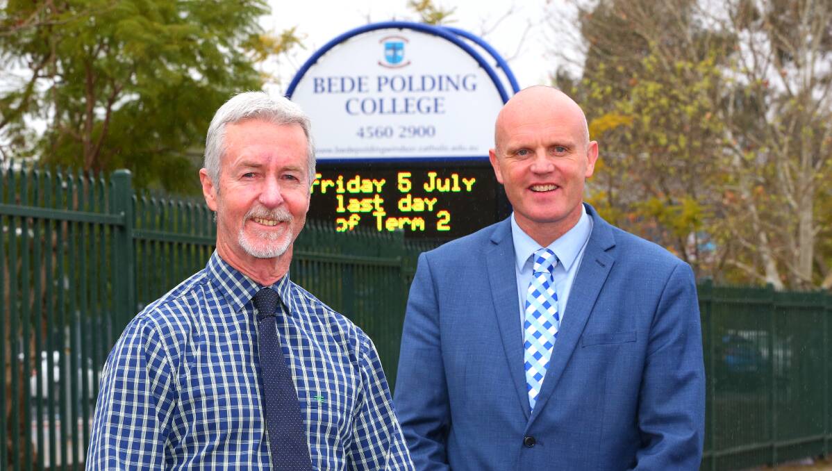Colleagues: Greg Moffitt (left), currently a maths teacher at Bede Polding College, is pictured here with Bede Polding principal Mark Compton.