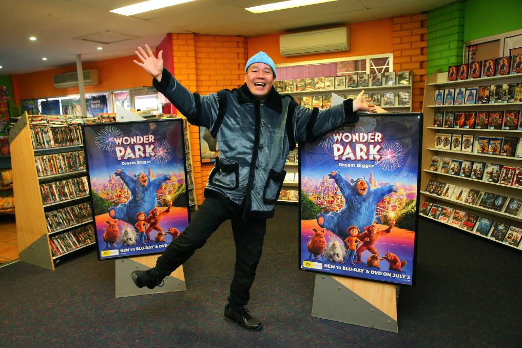 Movie love: Guirong Wu at his Civic Video store in Windsor, NSW, which is well on its way to becoming the last video shop in Australia. Picture: Geoff Jones