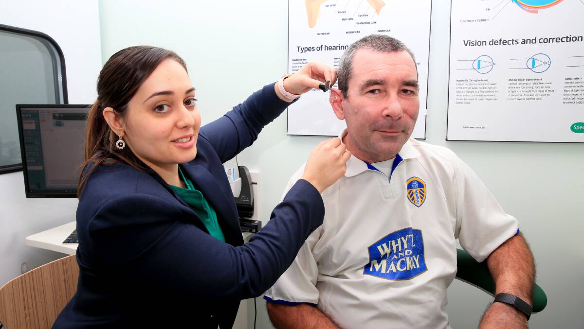 Hearing health: Local tradie Nathan Fisher with Specsavers audiologist Natali Carleton who fitted him with hearing aids at the Richmond store. Picture: Geoff Jones