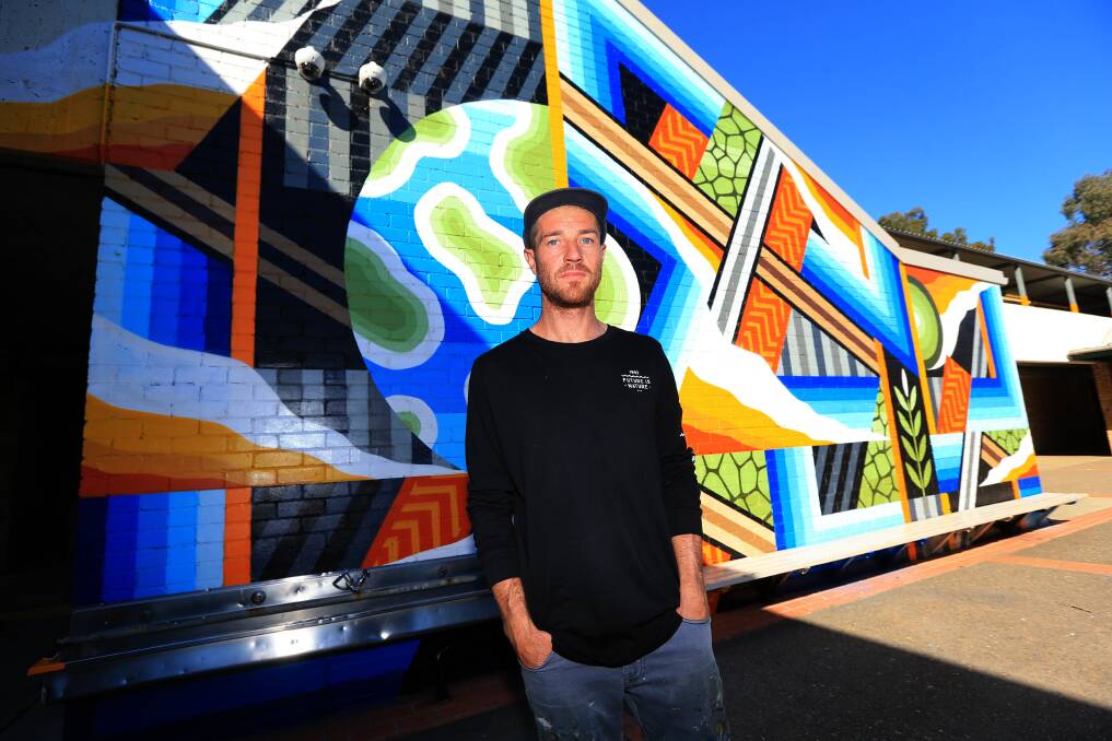 Artist Bradley Eastman AKA Beastman said he loved doing murals at schools and was passionate about bringing more public art to Western Sydney. Picture Geoff Jones