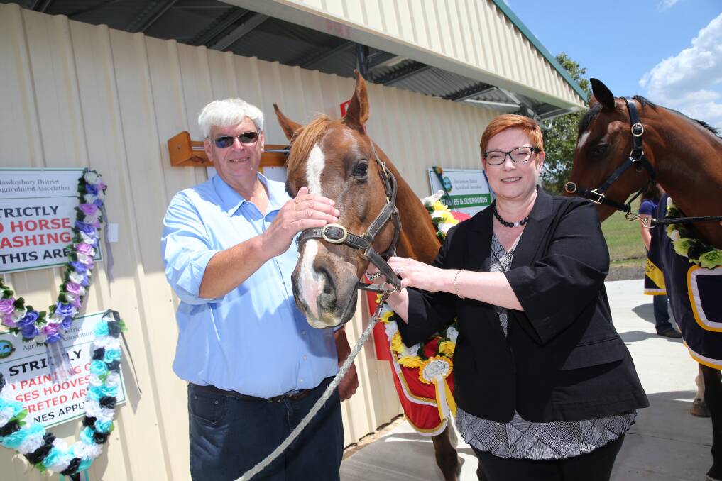 Facility upgrade: Liberal Senator for Western Sydney, Marise Payne, with HDAA president Ross Matheson at the new horse stables at Hawkesbury Showground. Picture: Geoff Jones