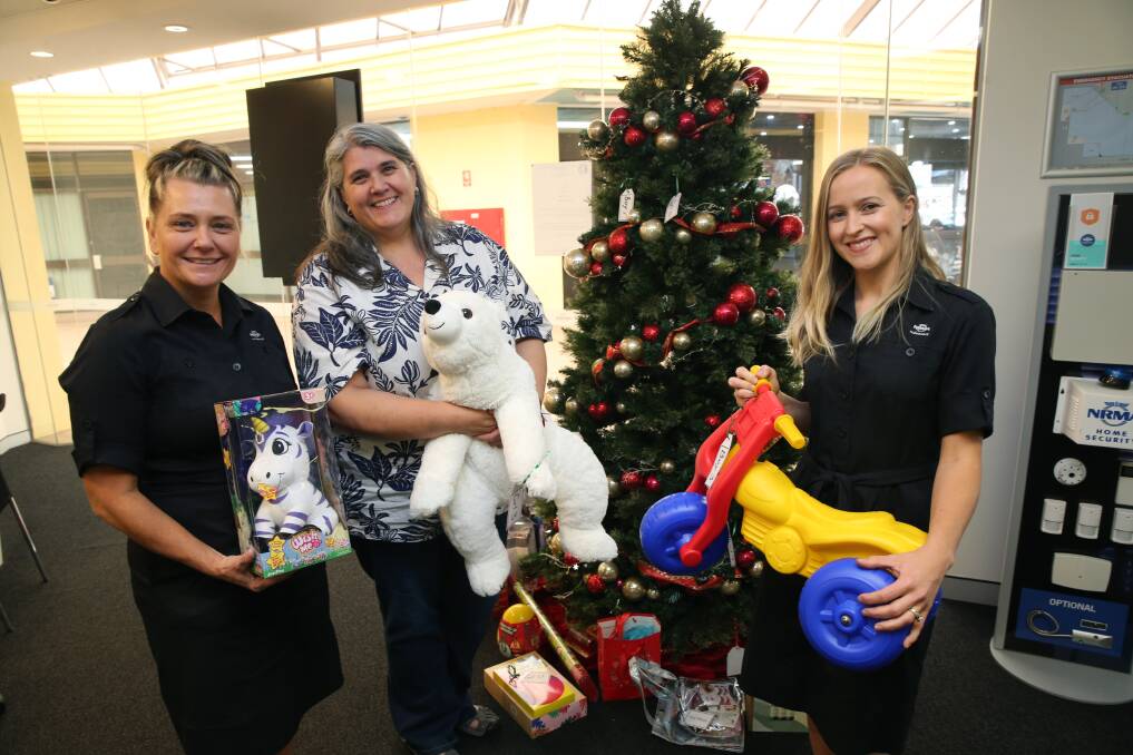 Giving spirit: Women's Cottage Manager Maria Losurdo with NRMA Richmond Branch host Christine Tyler (L) and executive consultant Jade Epiha promoting the Giving Tree. Picture: Geoff Jones.