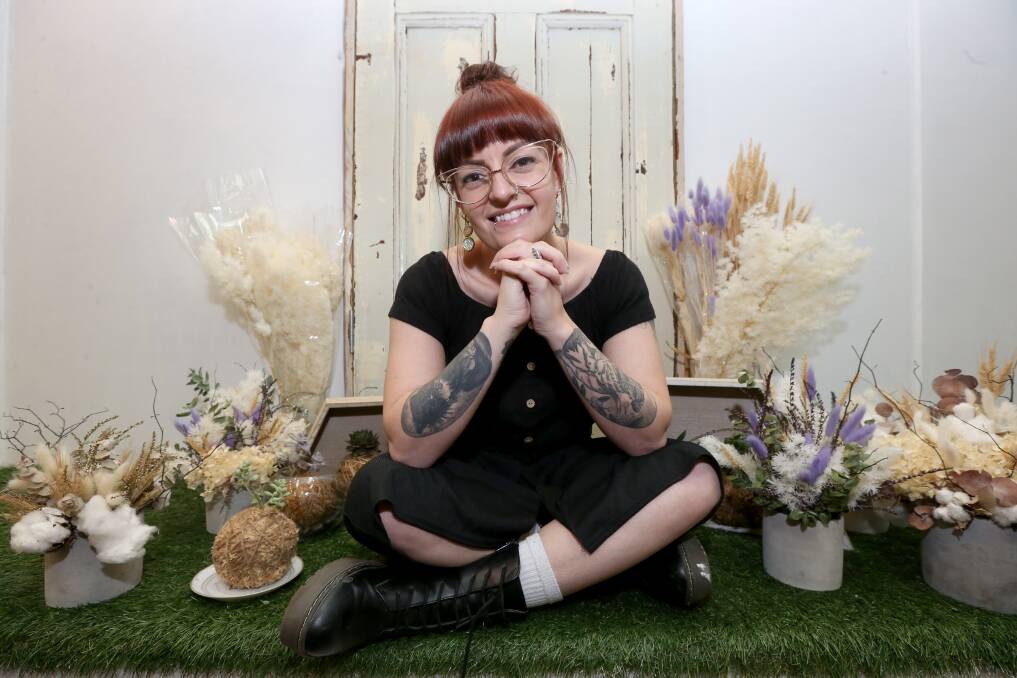 Frondy friends: Dahlia Doll owner Jade Heath at her Windsor shop, which will specialise in dried flower arrangements and Kokedamas. Picture: Geoff Jones