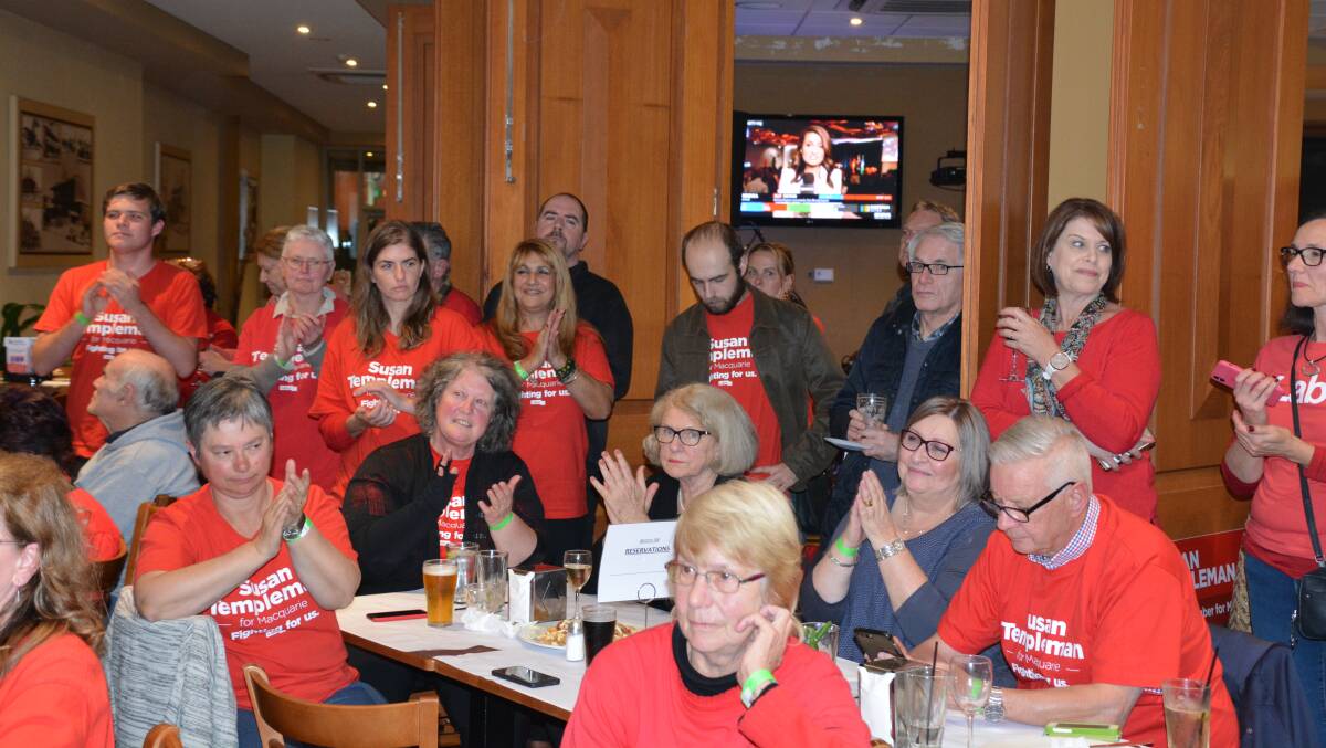 Labor supporters react as Susan Templeman addresses them at Springwood's Royal Hotel on election night.